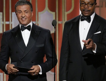 BEVERLY HILLS, CA - JANUARY 08: In this handout photo provided by NBCUniversal, Sylvester Stallone (L) and Carl Weathers, who co-starred in the 1977 Golden Globe Award-winning film "Rocky", present the Golden Globe for Best Motion Picture - Drama  onstage during the 74th Annual Golden Globe Awards at The Beverly Hilton Hotel on January 8, 2017 in Beverly Hills, California. (Photo by Paul Drinkwater/NBCUniversal via Getty Images)